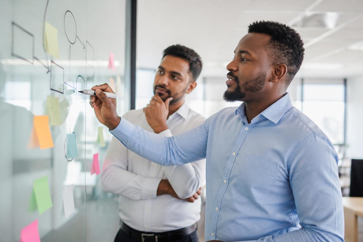 Caribbean professionals at work on process mapping for UNVEIL