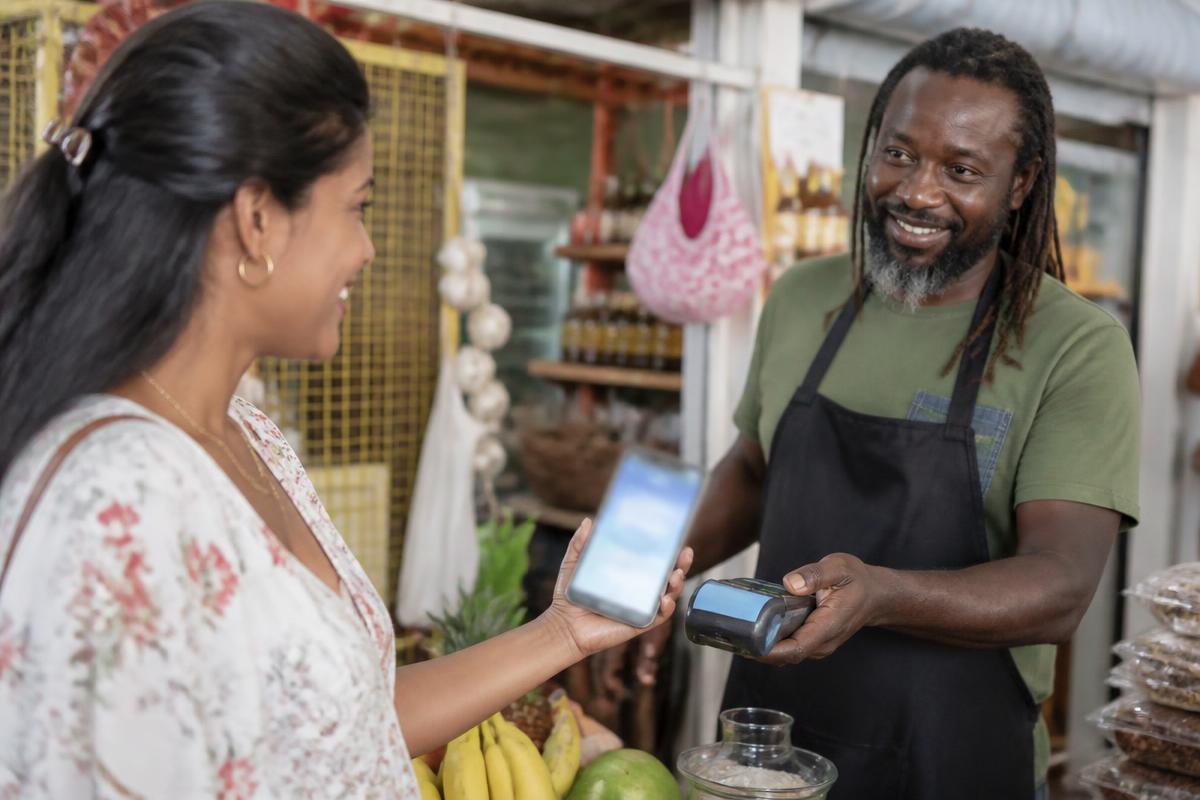 Caribbean professionals at work on wallet for START YESTERDAY